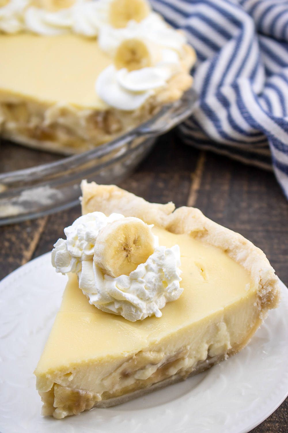 banana cream pie on a white plate