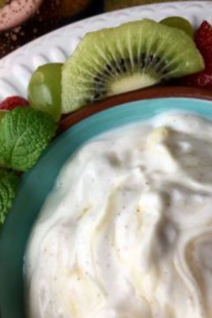 grape salad in a bowl with fruit on the side