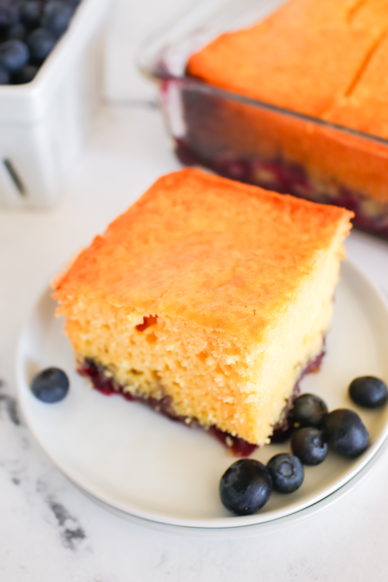 blueberry lemon cake on a white plate