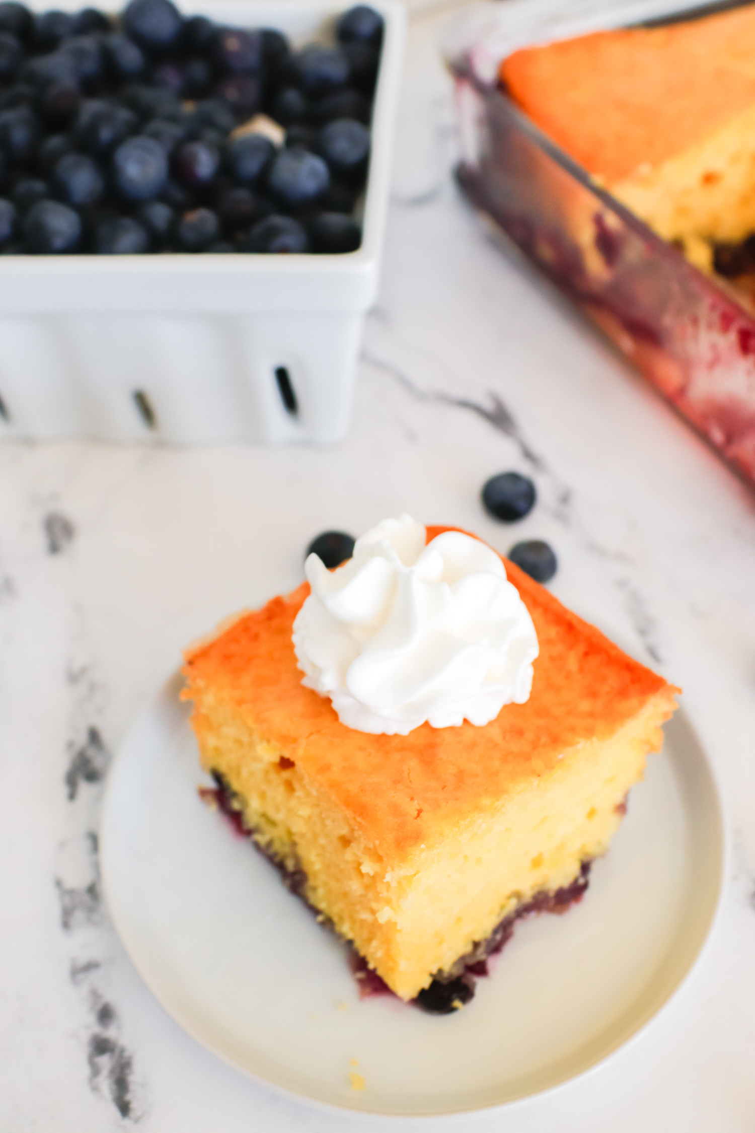 blueberry lemon cake on a white plate