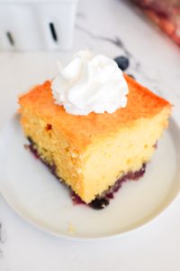 blueberry lemon cake slice on a white plate