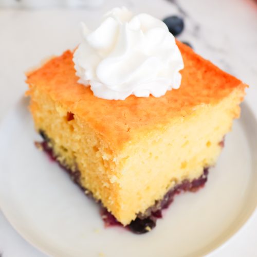 blueberry lemon cake slice on a white plate