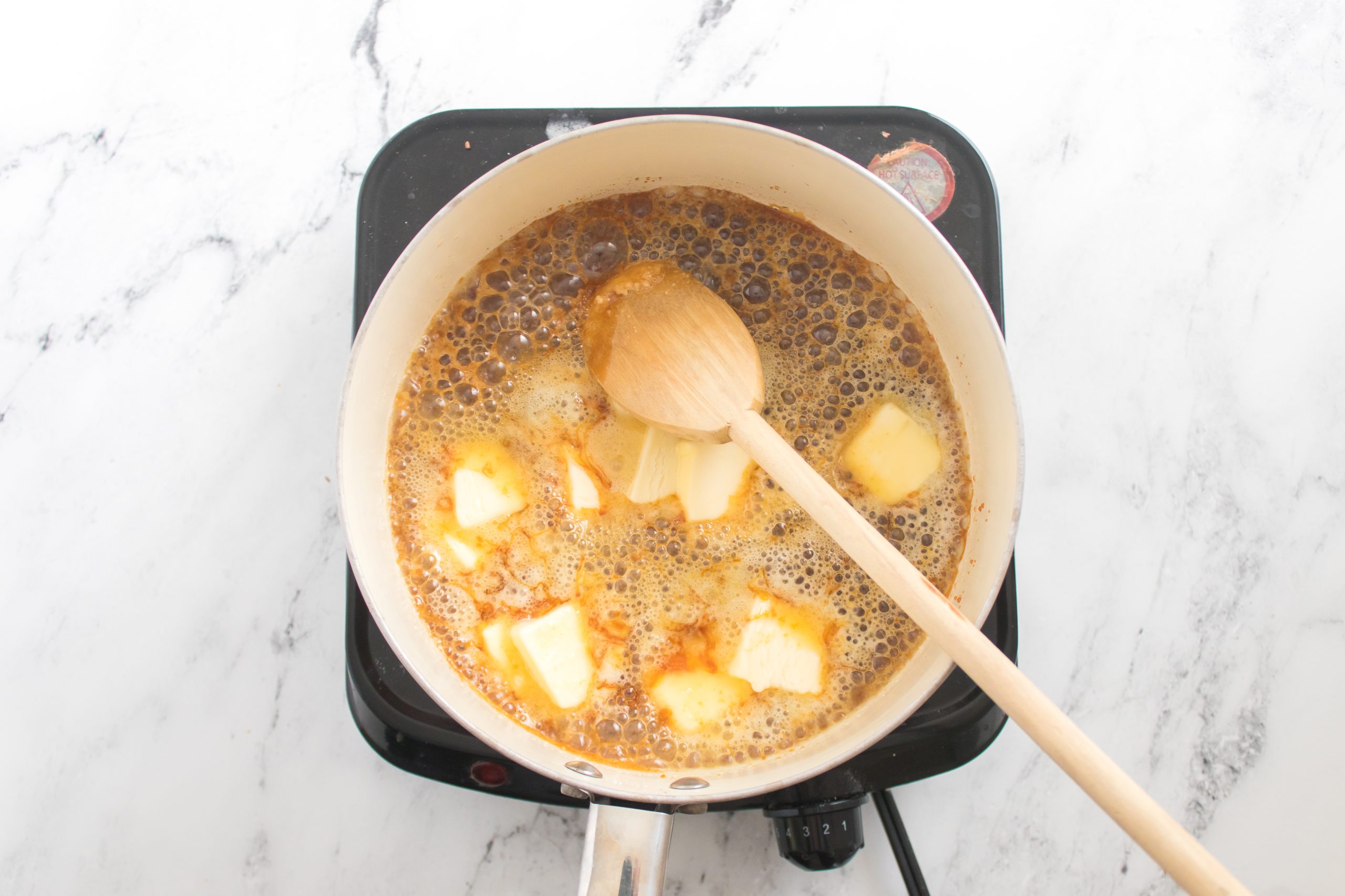 making the caramel. the butter being mixed in 