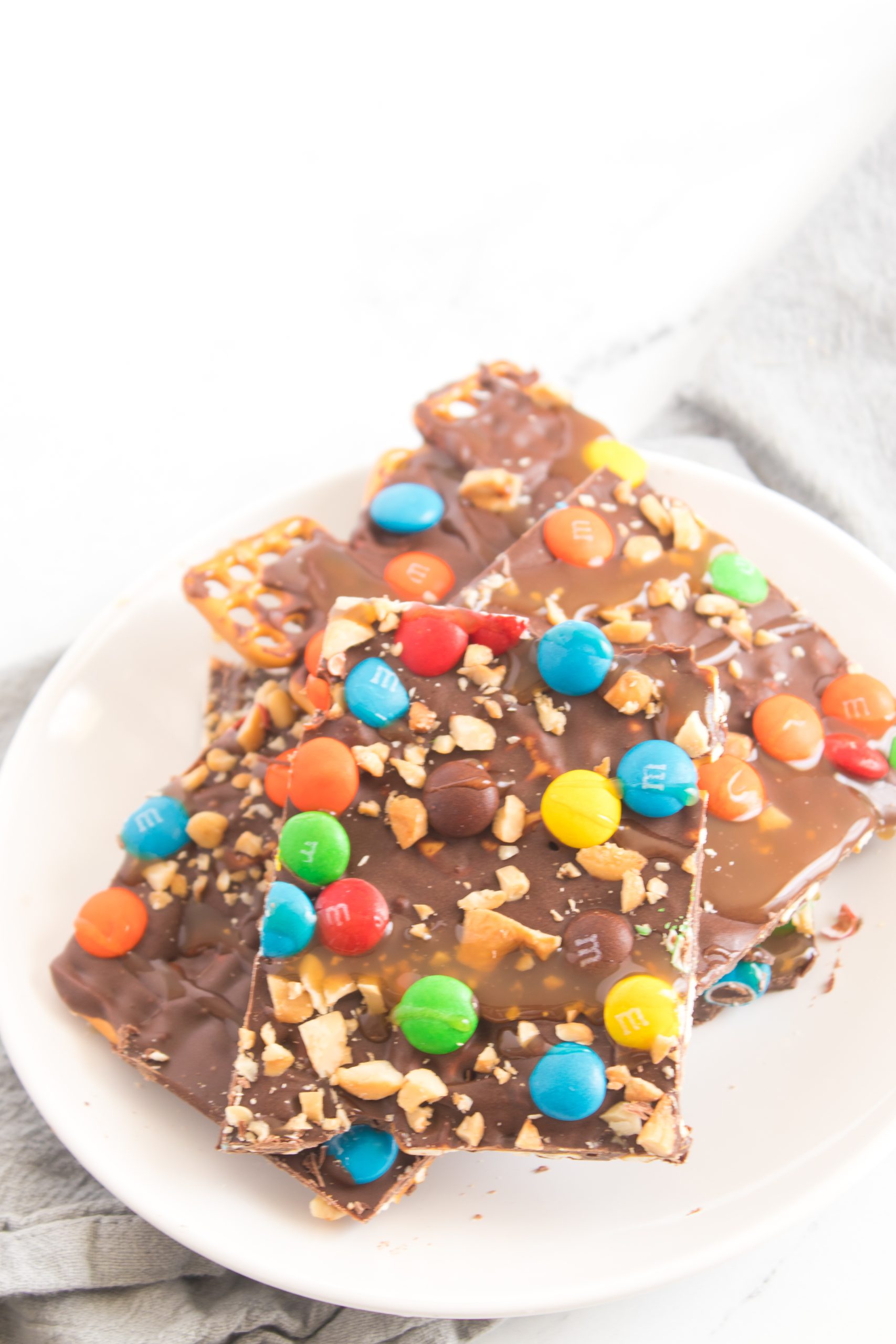 the chocolate caramel pretzel bark cut into a square 