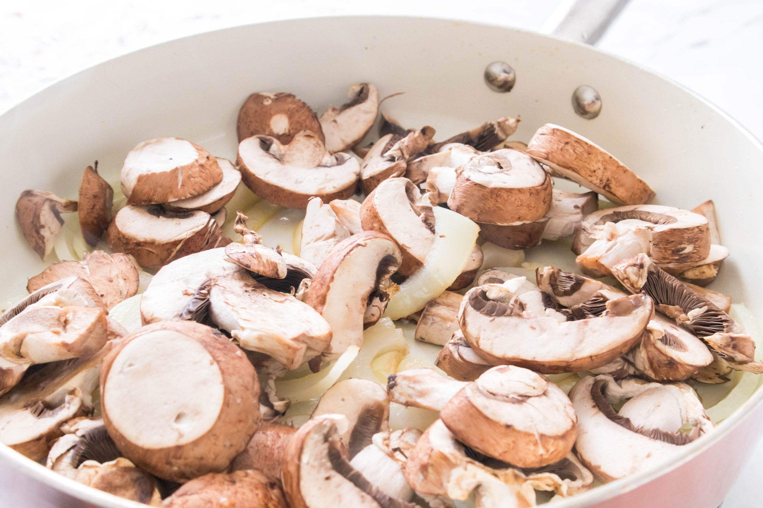 mushrooms and onions in a pan