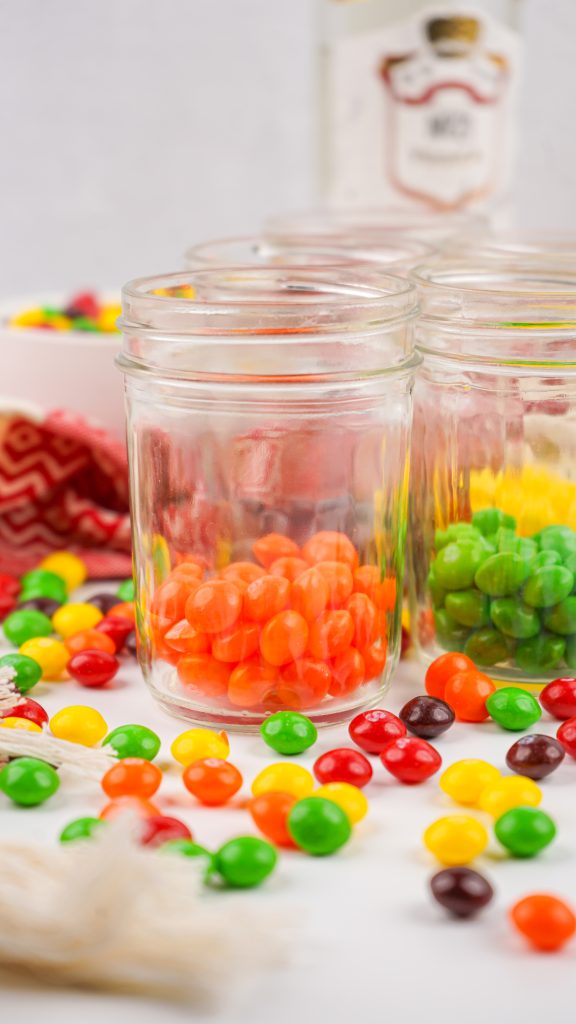 separate skittles into jars
