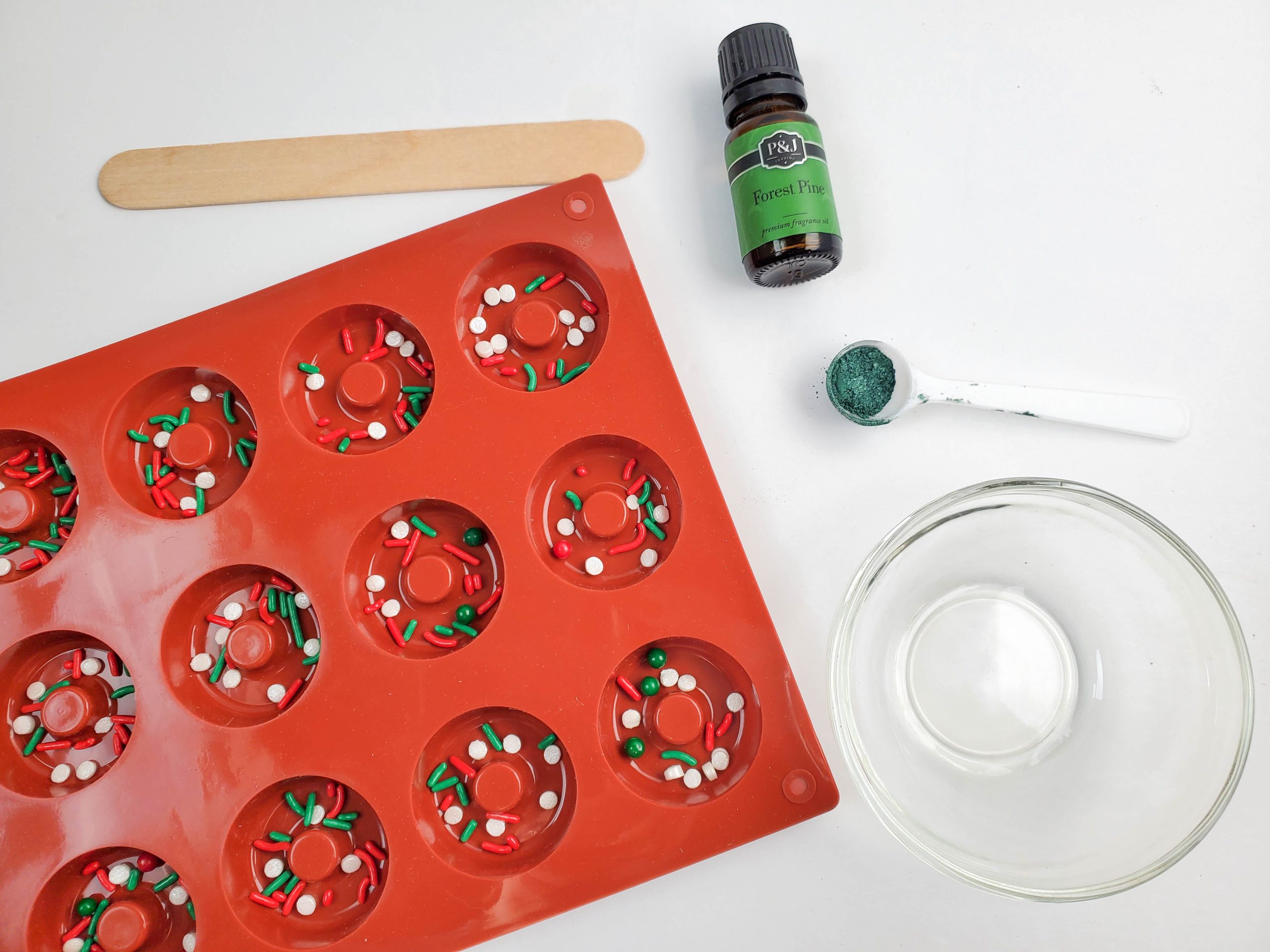 adding sprinkles to the bottom of the pan