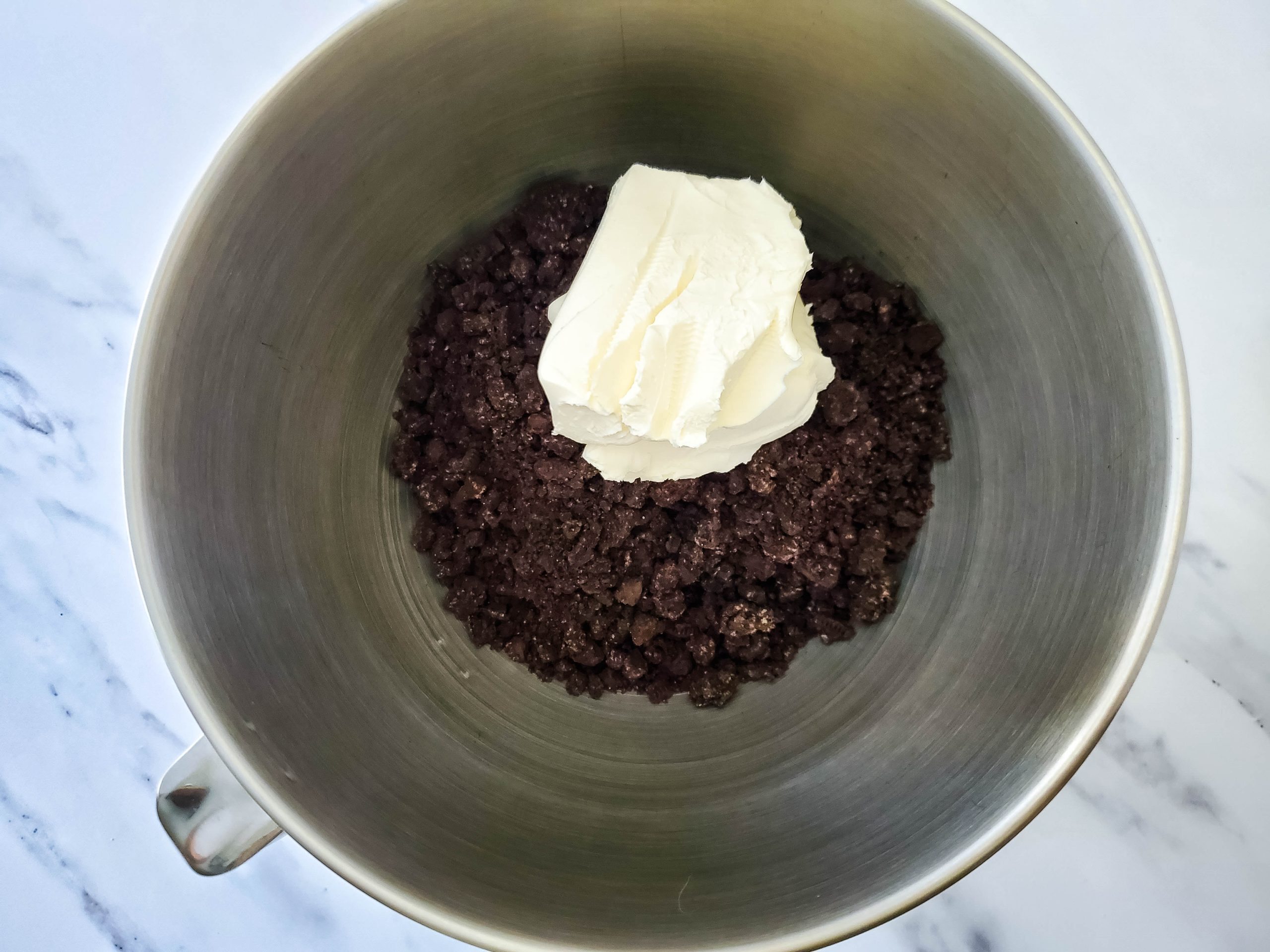 adding the cream cheese to the cookies