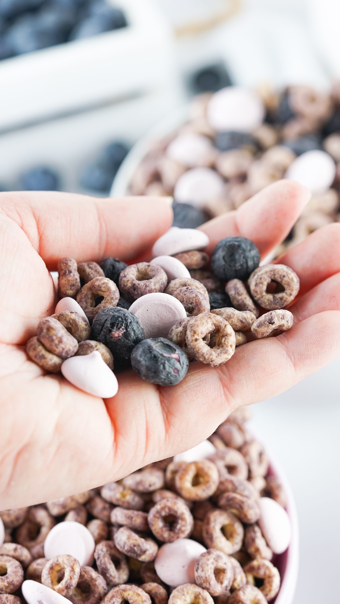 snack mix in a hand