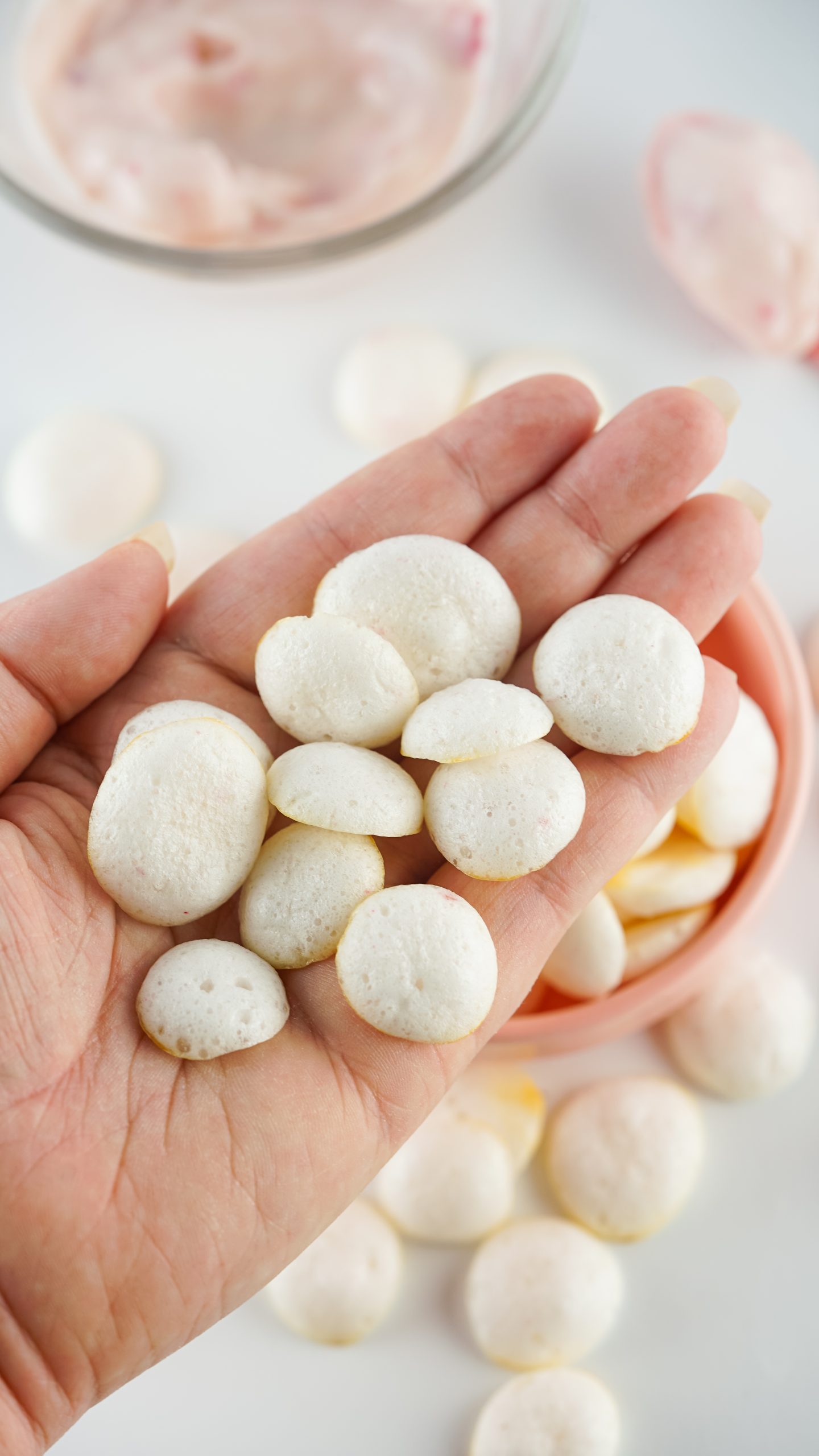overhead of homemade baby yogurt drops in someones hand