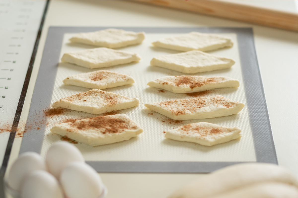 silicone baking mat with dough in diamond shapes