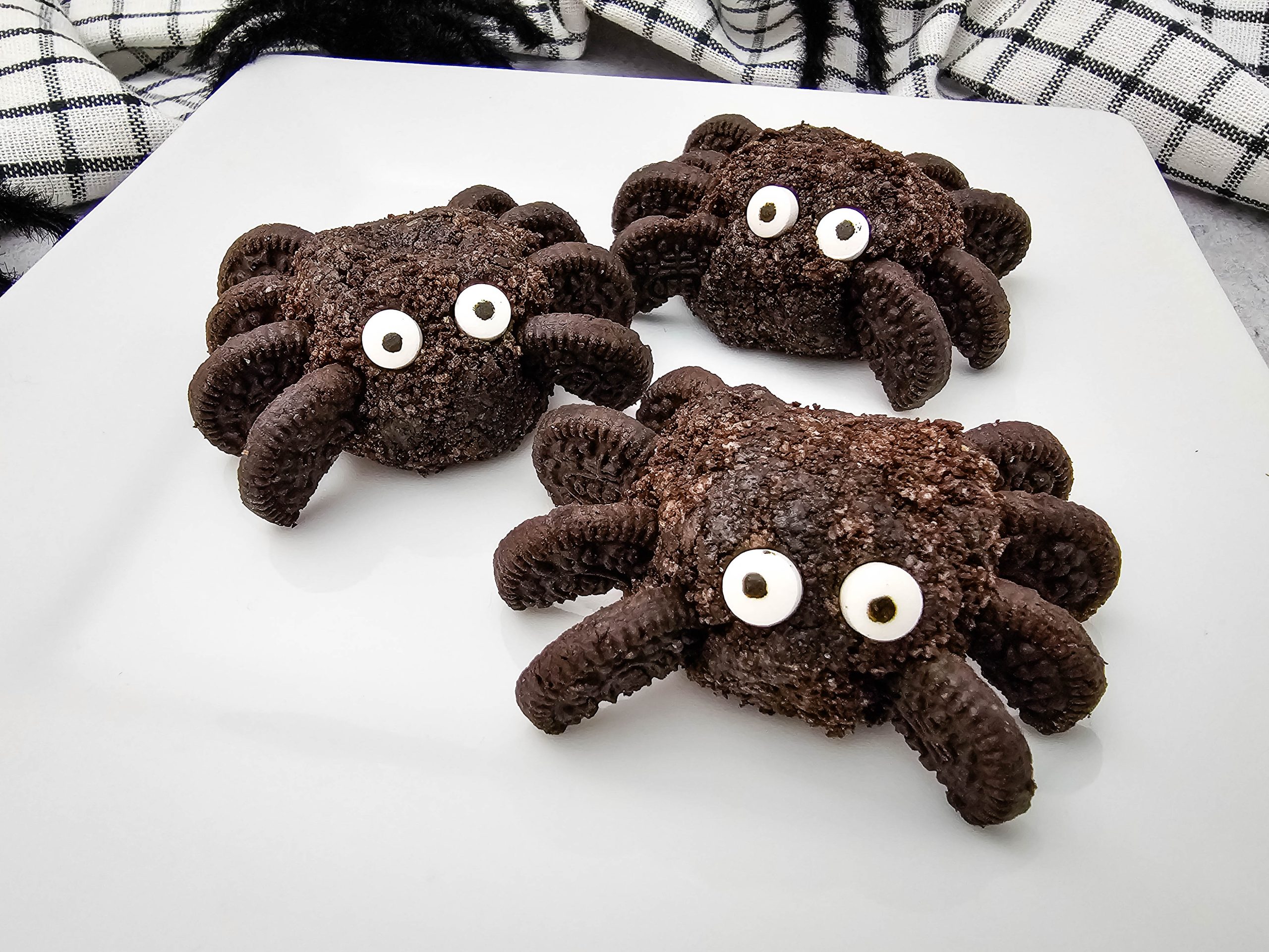 oreo spider balls on a white plate