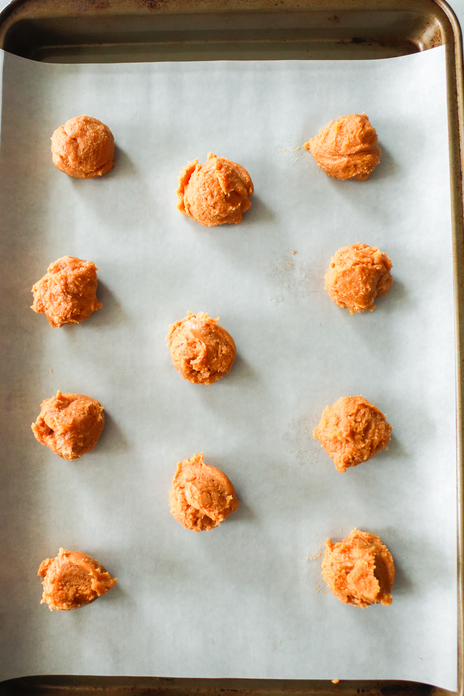 cookies scooped on a baking sheet