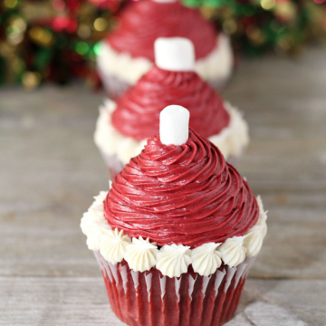 santa hat cupcakes in a row