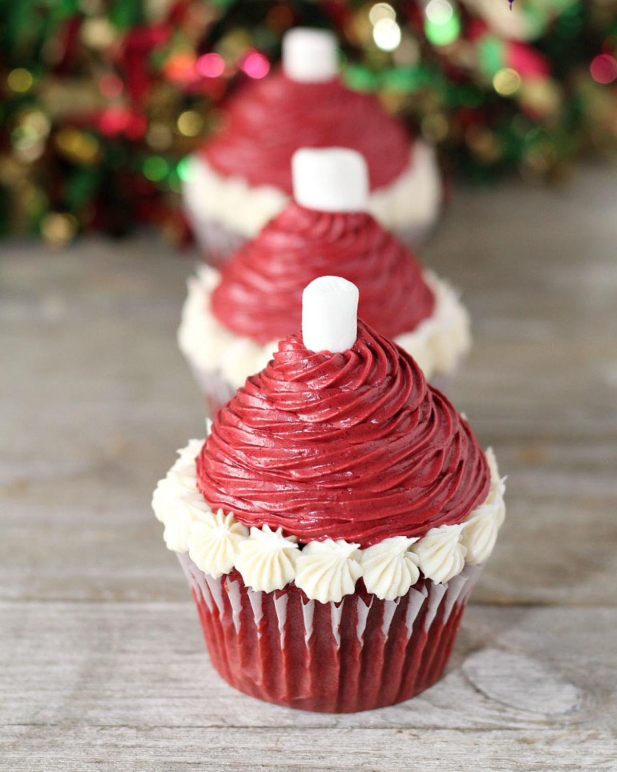 santa hat cupcakes in a row
