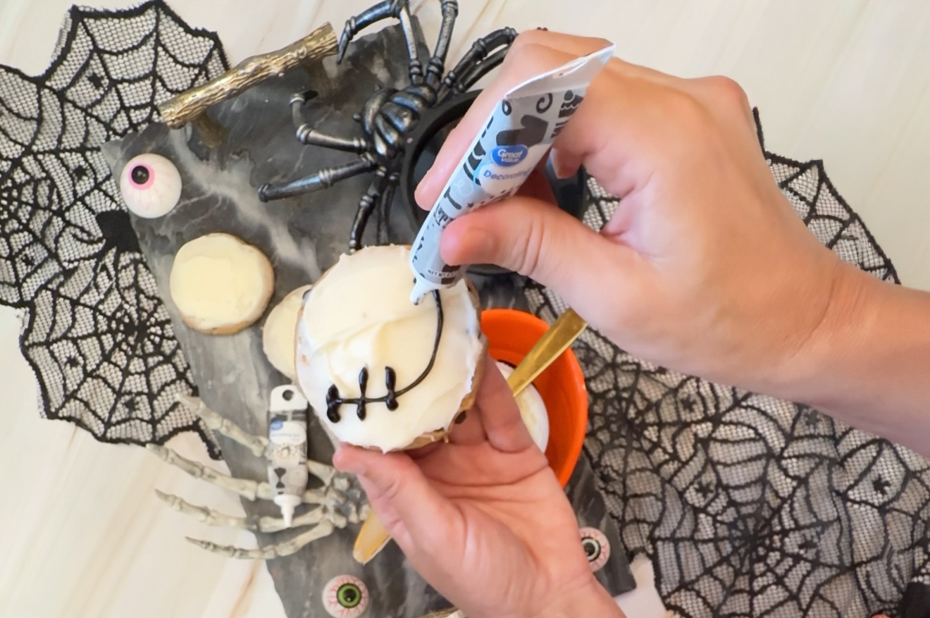 adding the smile to the cookies