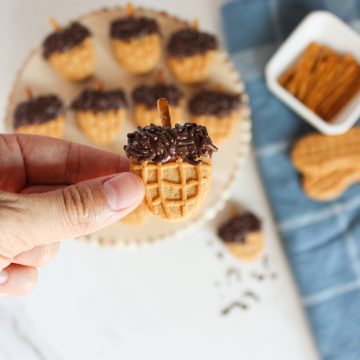 nutter butter acorn cookies in a hand