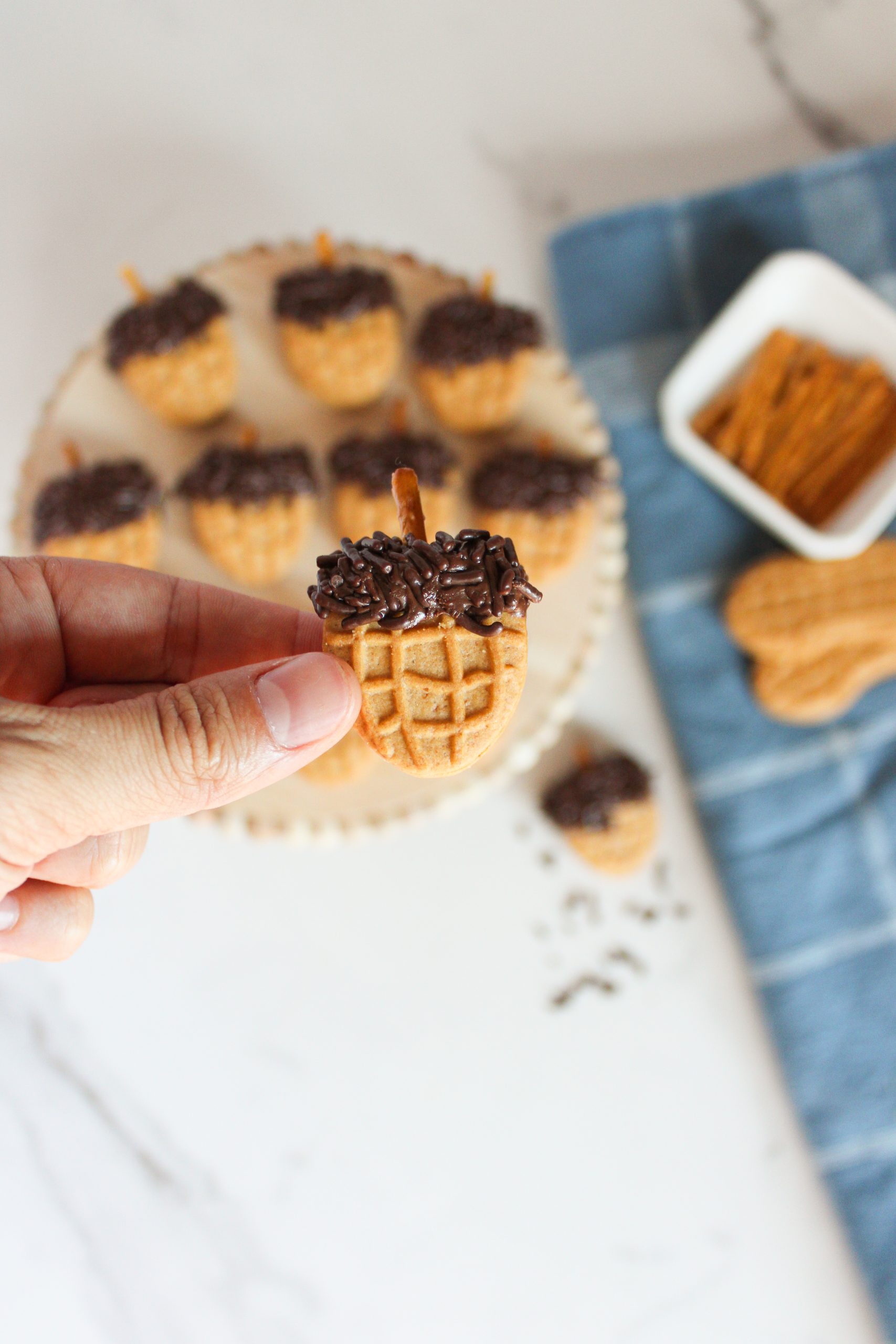 nutter butter acorn cookies in a hand