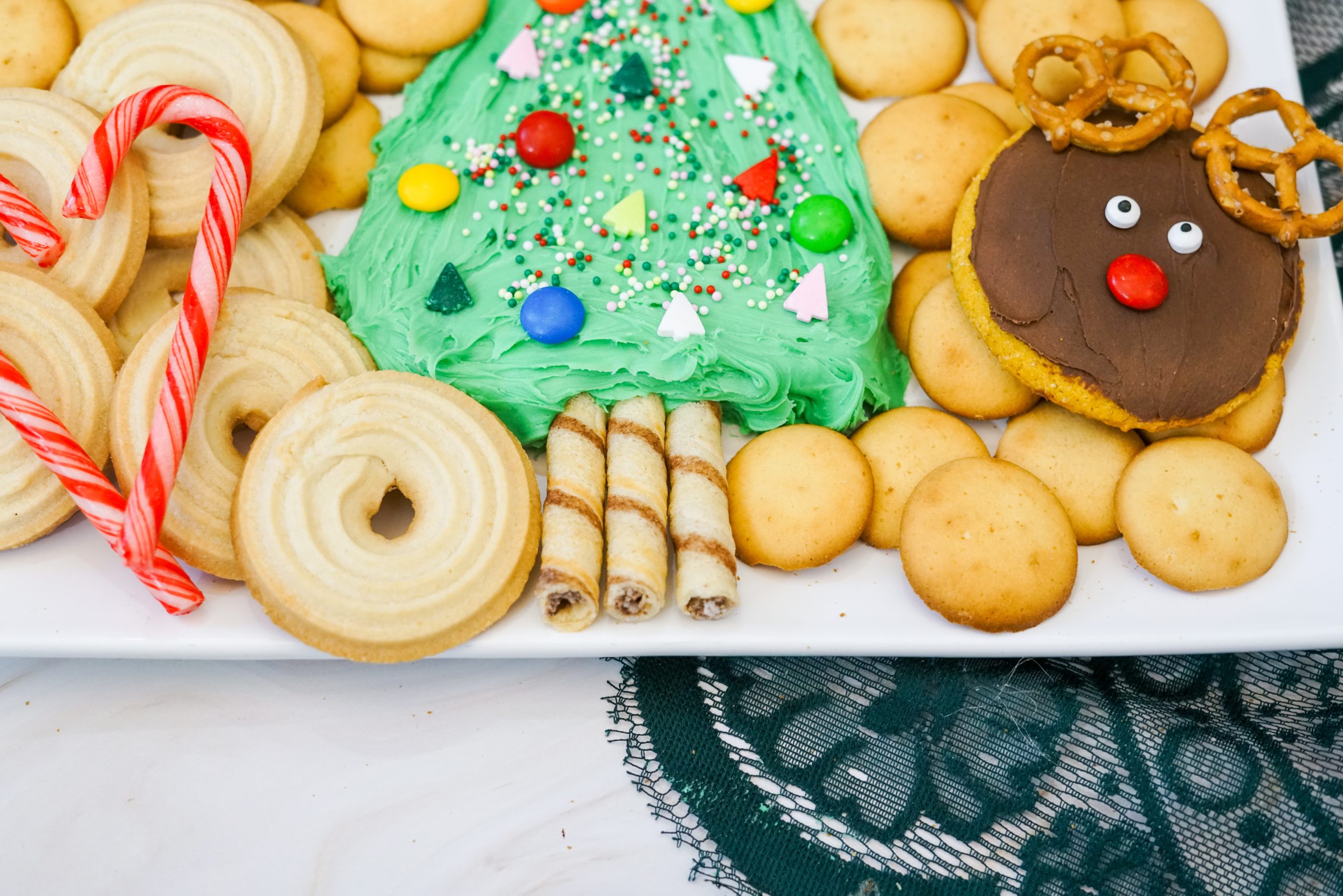 create the base of the tree and add cookies around the board