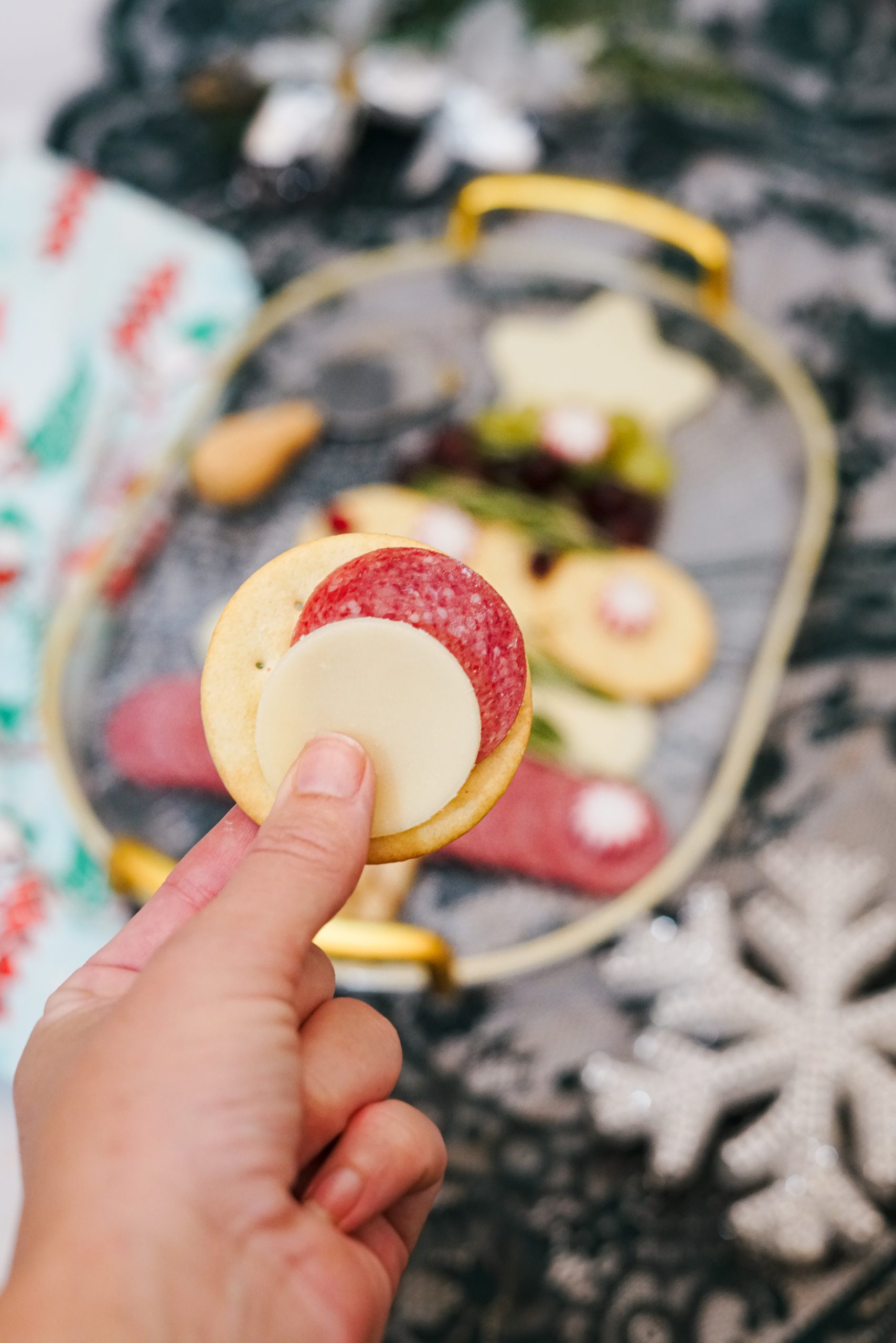 upclose of cracker and cheese of Tree Christmas charcuterie