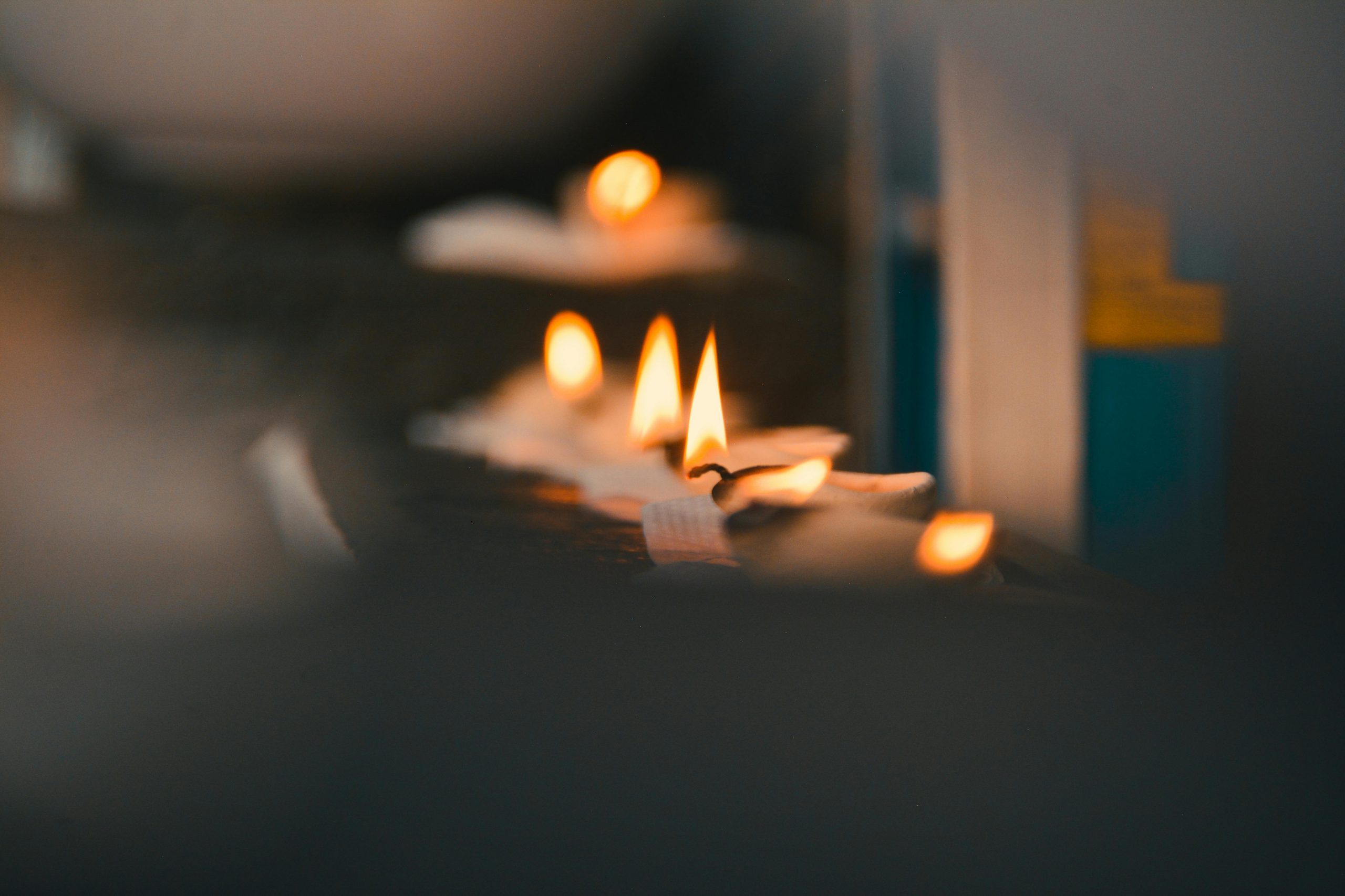 Close-up of flickering candle flames creating a warm atmosphere.