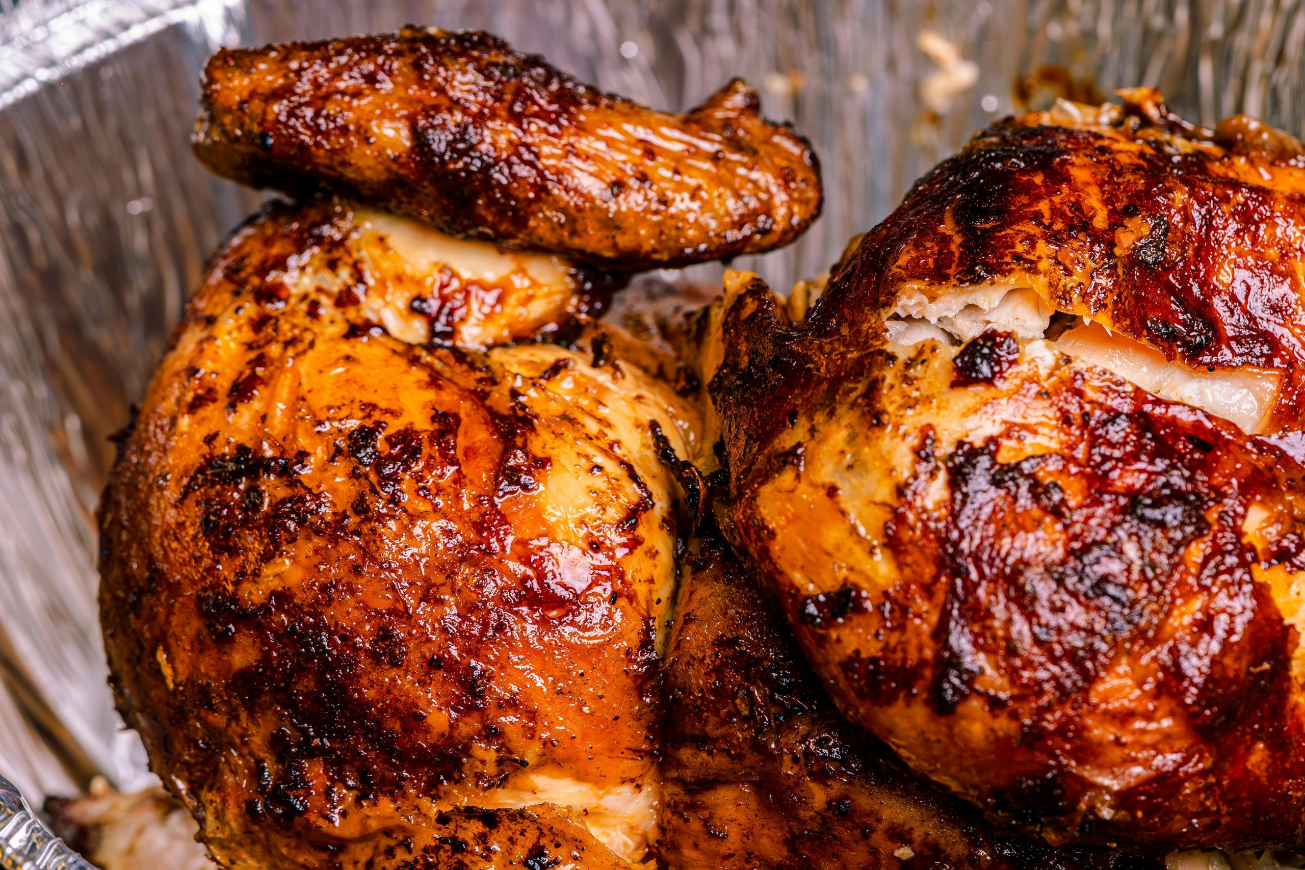 Deliciously roasted rotisserie chicken with crispy skin, perfect for a hearty meal.