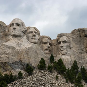 A striking view of Mount Rushmore featuring the carved faces of U.S. Presidents in the Black Hills of South Dakota.