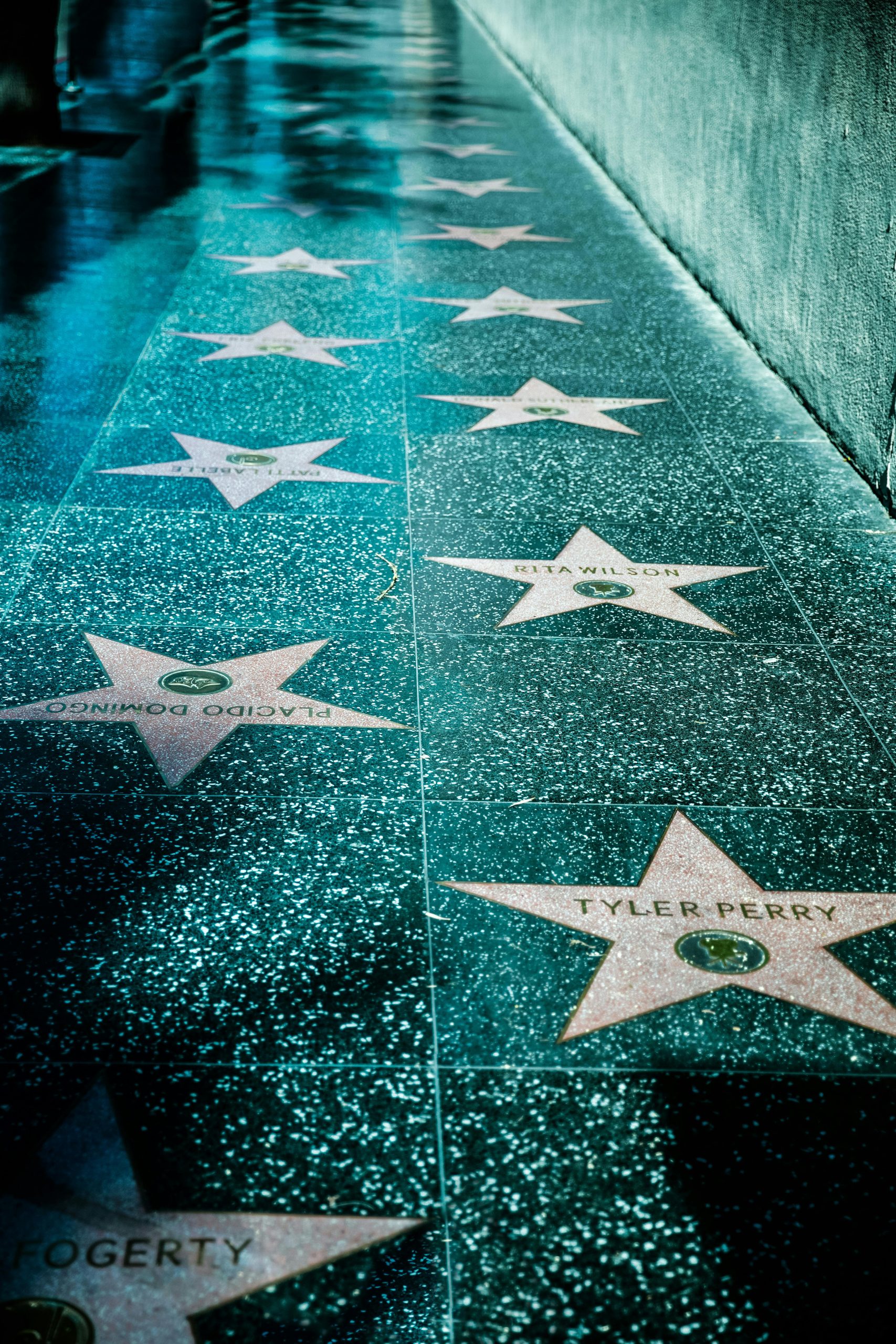 Capture of the Hollywood Walk of Fame stars on a shiny sidewalk in Los Angeles.